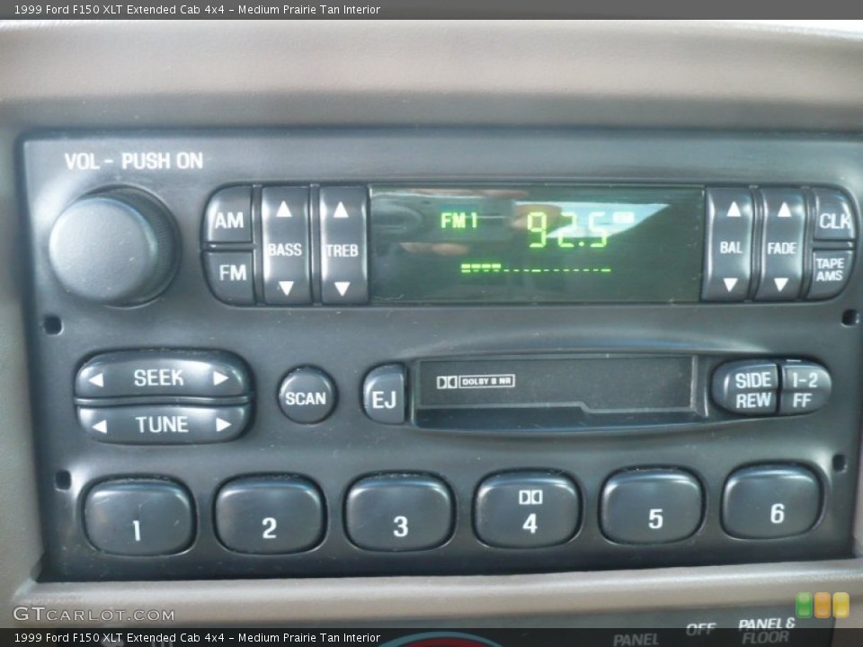 Medium Prairie Tan Interior Audio System for the 1999 Ford F150 XLT Extended Cab 4x4 #59861998