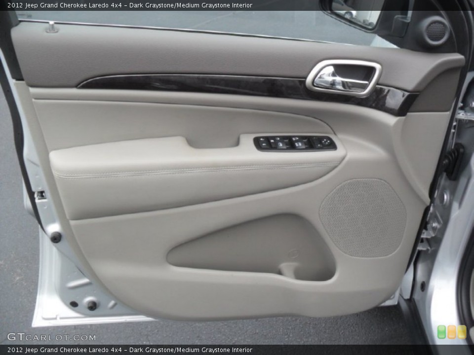 Dark Graystone/Medium Graystone Interior Door Panel for the 2012 Jeep Grand Cherokee Laredo 4x4 #59954639
