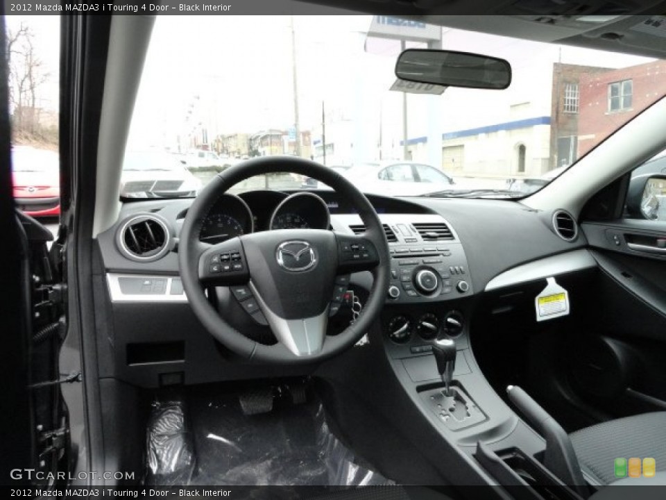 Black Interior Dashboard for the 2012 Mazda MAZDA3 i Touring 4 Door #60385826