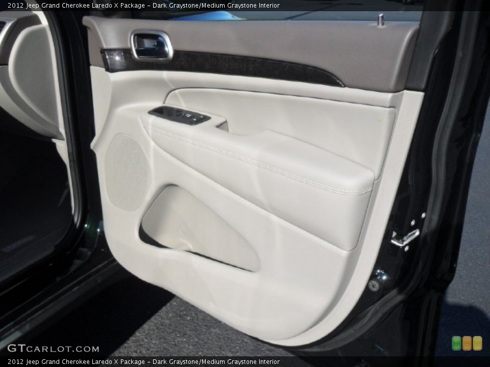 Dark Graystone/Medium Graystone Interior Door Panel for the 2012 Jeep Grand Cherokee Laredo X Package #60439130