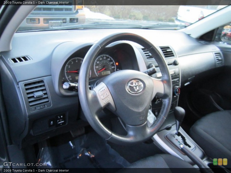 Dark Charcoal Interior Dashboard for the 2009 Toyota Corolla S #60838590