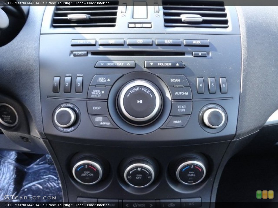 Black Interior Controls for the 2012 Mazda MAZDA3 s Grand Touring 5 Door #60984568