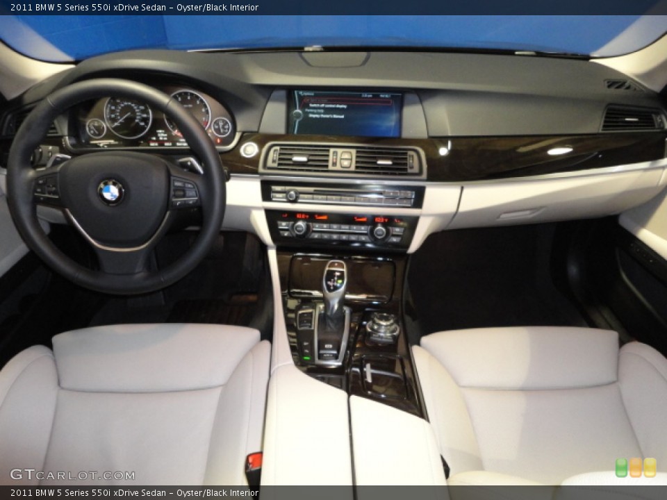 Oyster/Black Interior Dashboard for the 2011 BMW 5 Series 550i xDrive Sedan #61057387