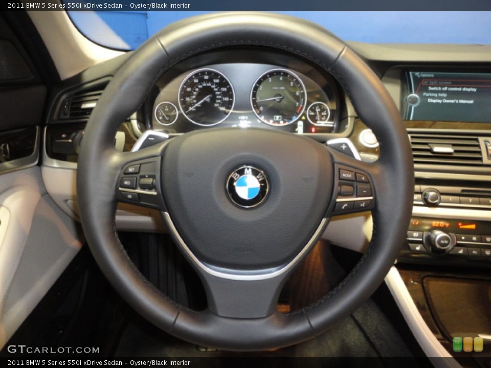 Oyster/Black Interior Steering Wheel for the 2011 BMW 5 Series 550i xDrive Sedan #61057396