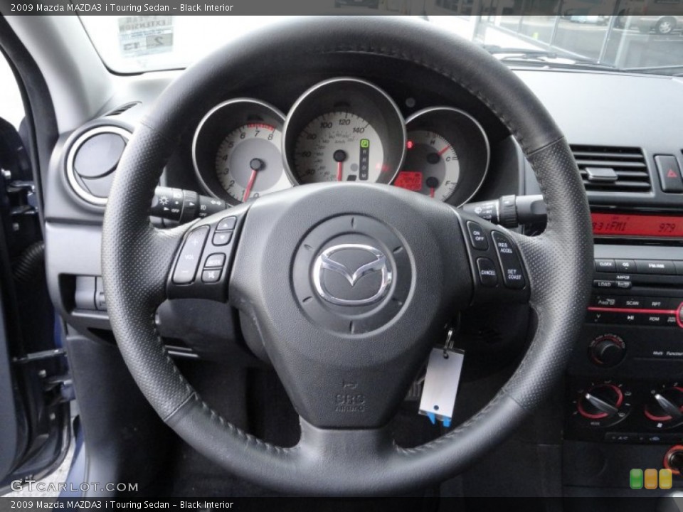 Black Interior Steering Wheel for the 2009 Mazda MAZDA3 i Touring Sedan #61275180
