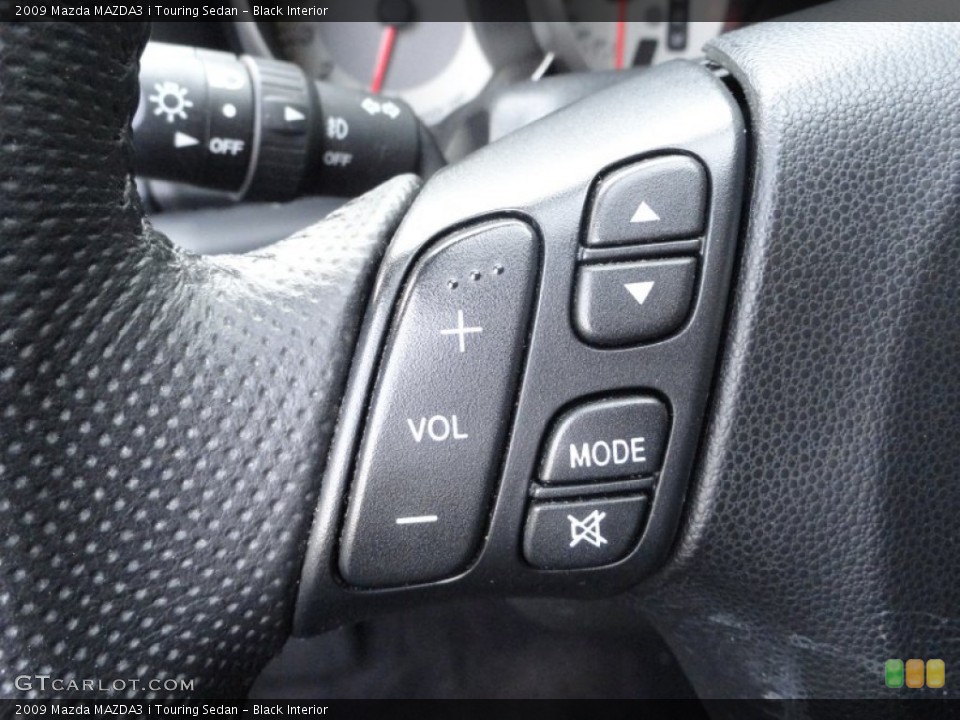 Black Interior Controls for the 2009 Mazda MAZDA3 i Touring Sedan #61275191