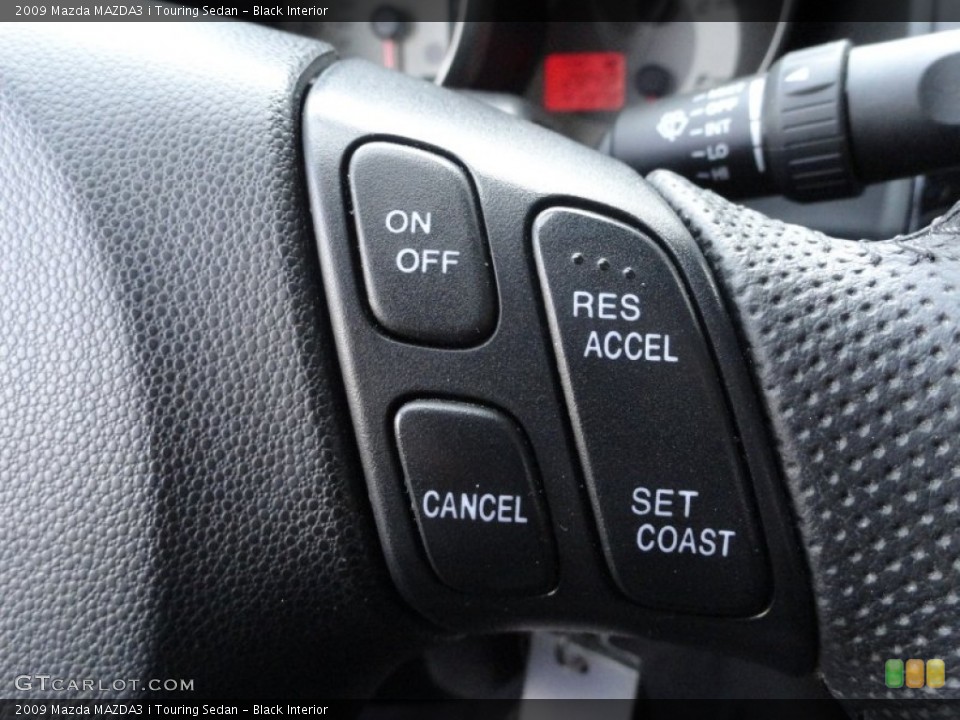 Black Interior Controls for the 2009 Mazda MAZDA3 i Touring Sedan #61275200