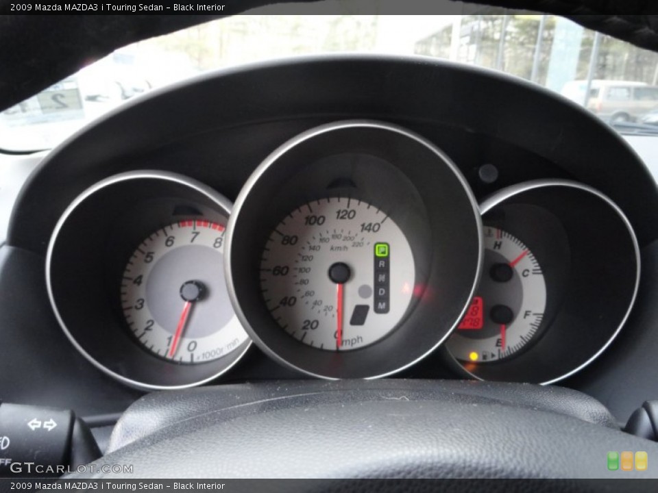 Black Interior Gauges for the 2009 Mazda MAZDA3 i Touring Sedan #61275209