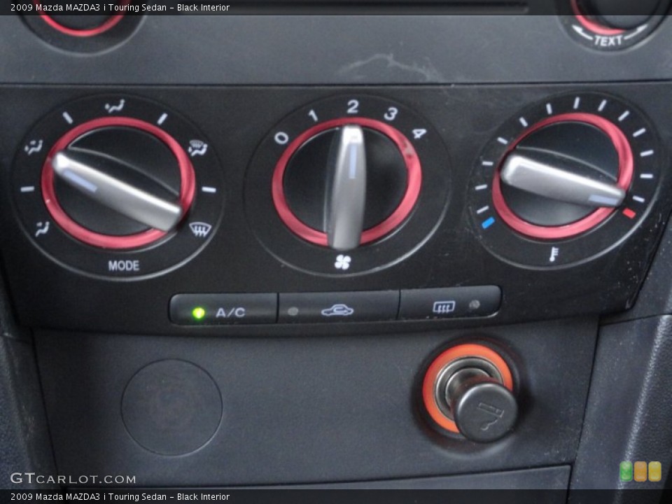 Black Interior Controls for the 2009 Mazda MAZDA3 i Touring Sedan #61275242