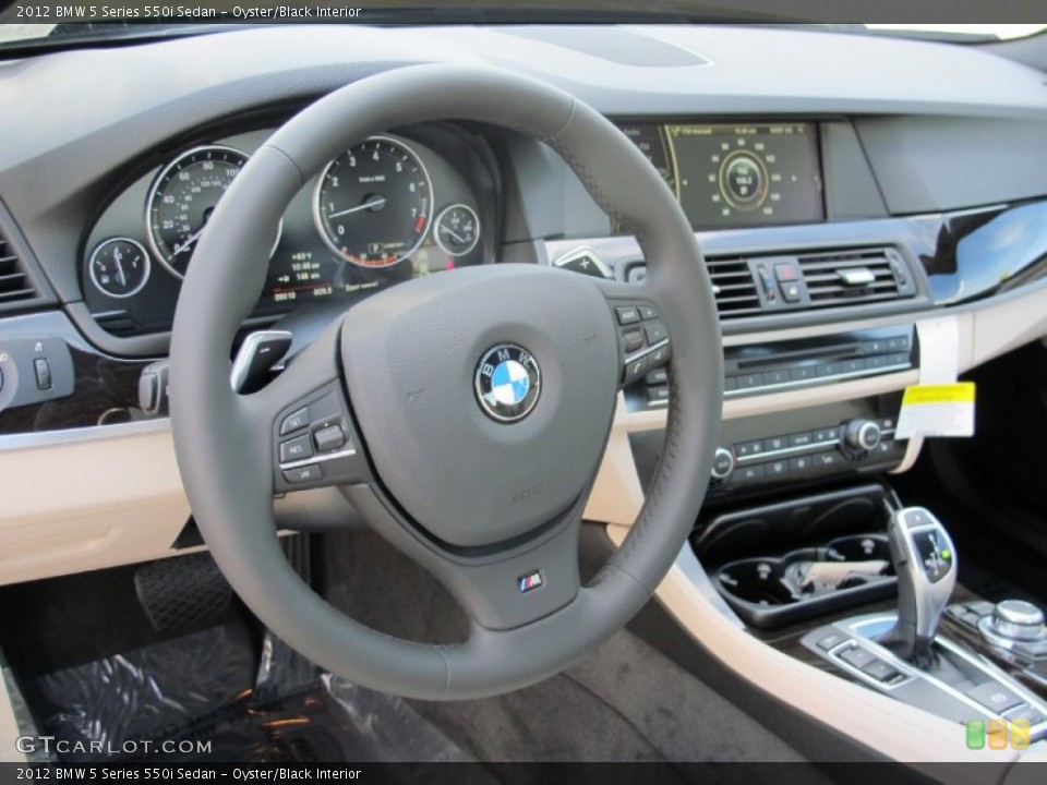 Oyster/Black Interior Steering Wheel for the 2012 BMW 5 Series 550i Sedan #61373352