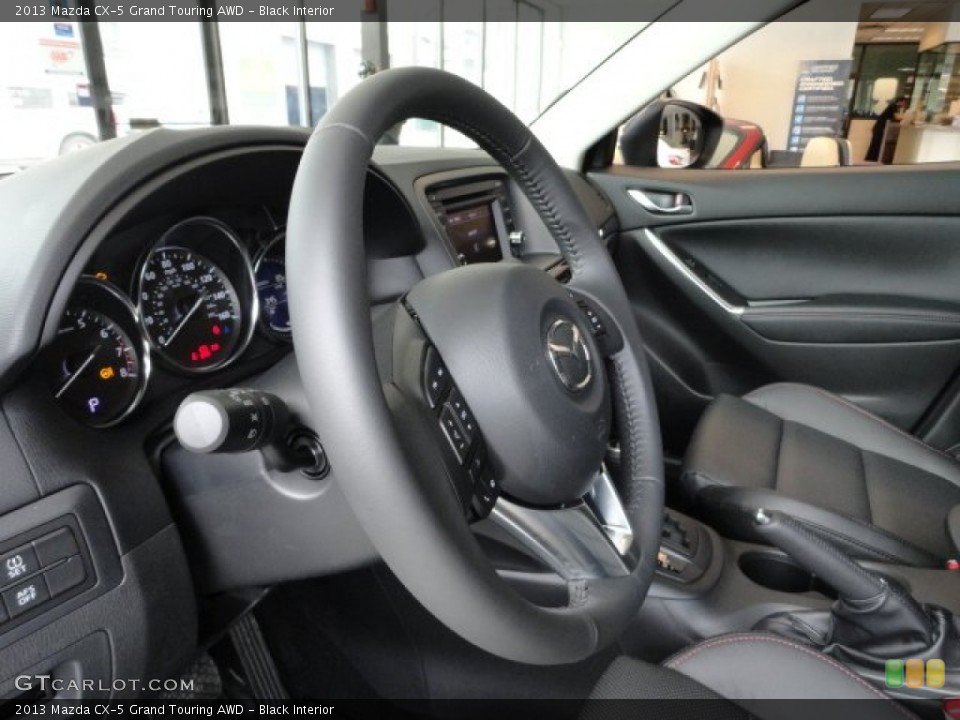 Black Interior Steering Wheel for the 2013 Mazda CX-5 Grand Touring AWD #61606716
