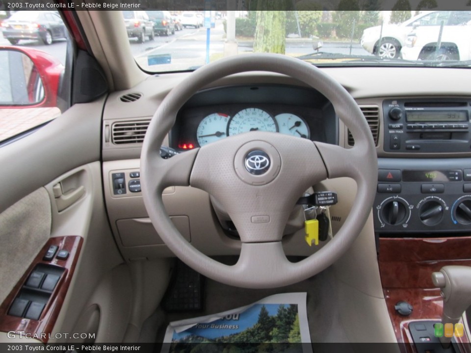 Pebble Beige Interior Steering Wheel for the 2003 Toyota Corolla LE #61851108