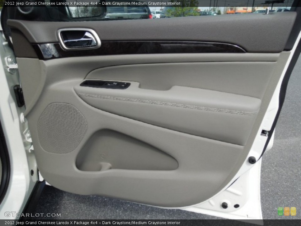 Dark Graystone/Medium Graystone Interior Door Panel for the 2012 Jeep Grand Cherokee Laredo X Package 4x4 #62017398