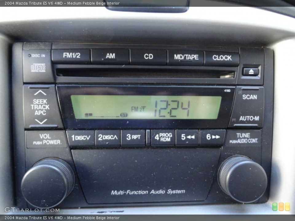 Medium Pebble Beige Interior Audio System for the 2004 Mazda Tribute ES V6 4WD #62028057