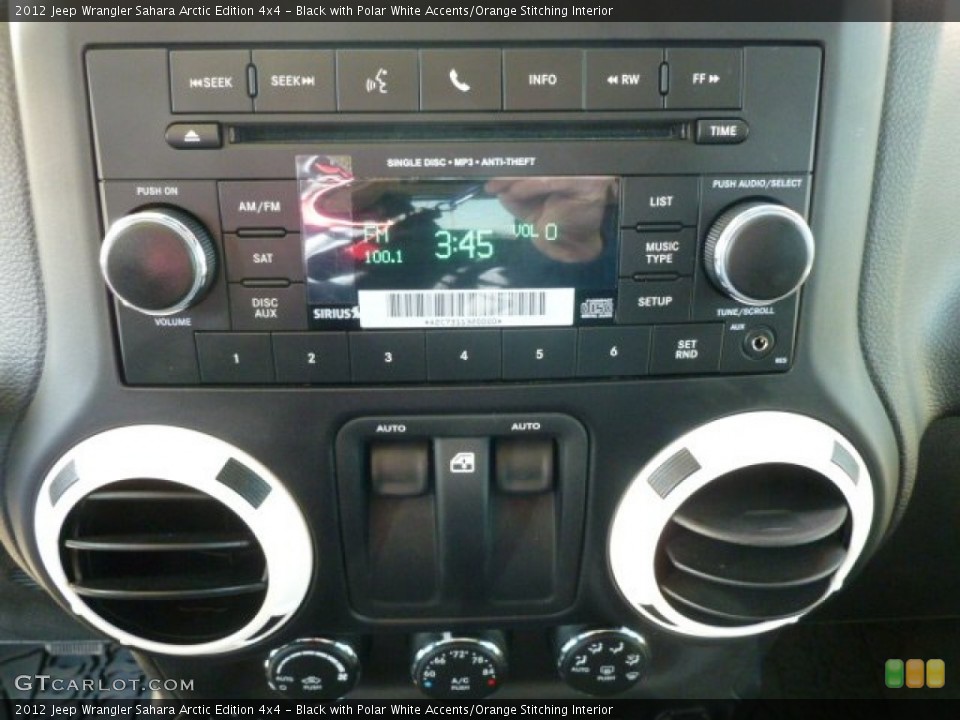 Black with Polar White Accents/Orange Stitching Interior Controls for the 2012 Jeep Wrangler Sahara Arctic Edition 4x4 #62033494