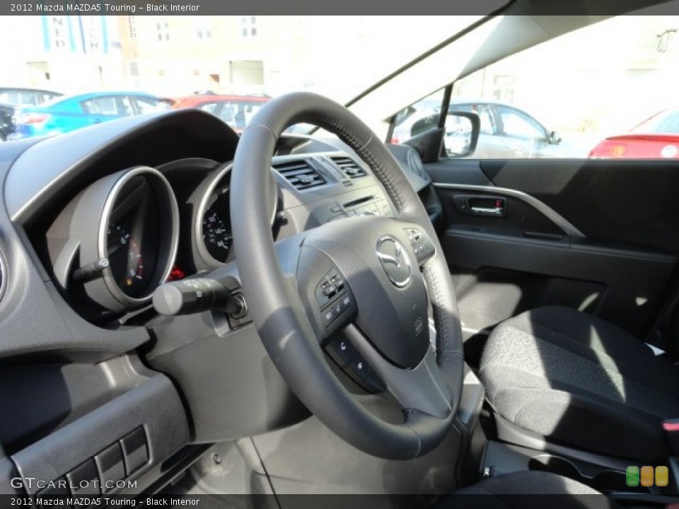 Black Interior Steering Wheel for the 2012 Mazda MAZDA5 Touring #62044506