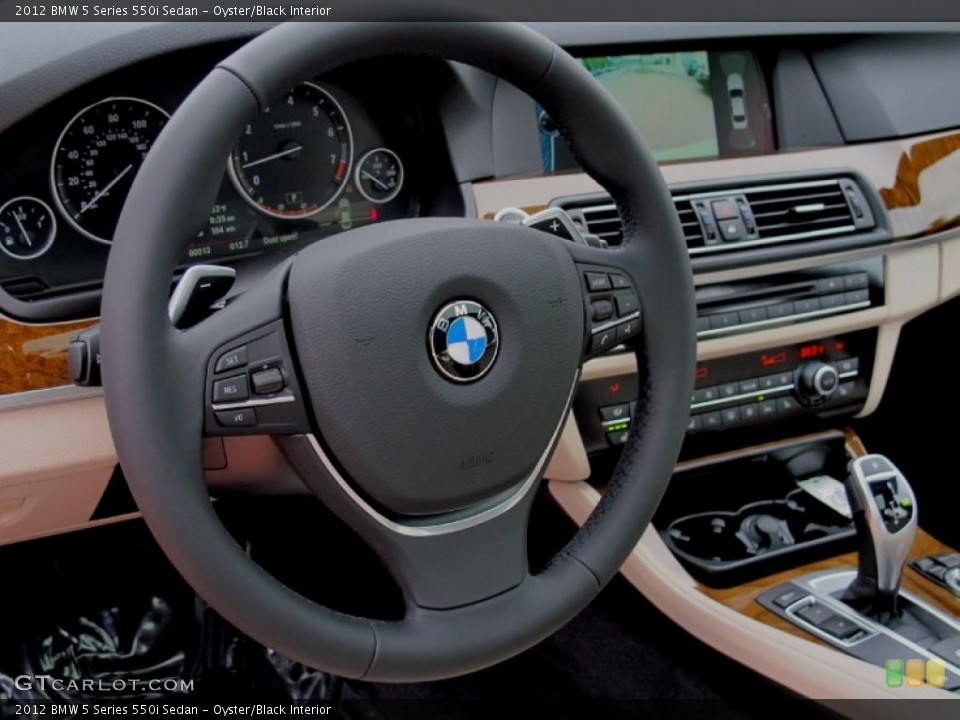 Oyster/Black Interior Steering Wheel for the 2012 BMW 5 Series 550i Sedan #62217661