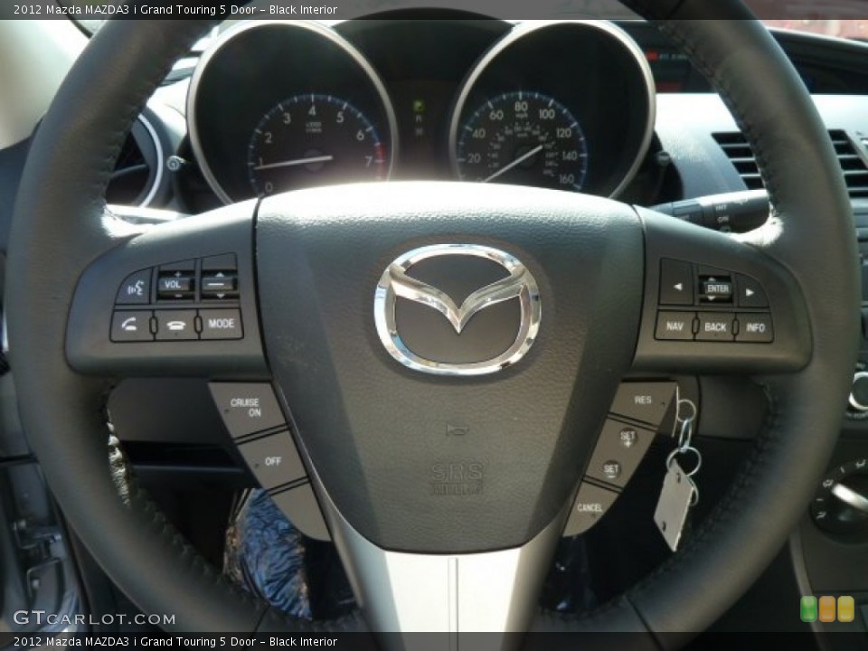 Black Interior Steering Wheel for the 2012 Mazda MAZDA3 i Grand Touring 5 Door #62531872