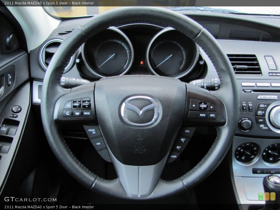 Black Interior Steering Wheel for the 2011 Mazda MAZDA3 s Sport 5 Door #62686073