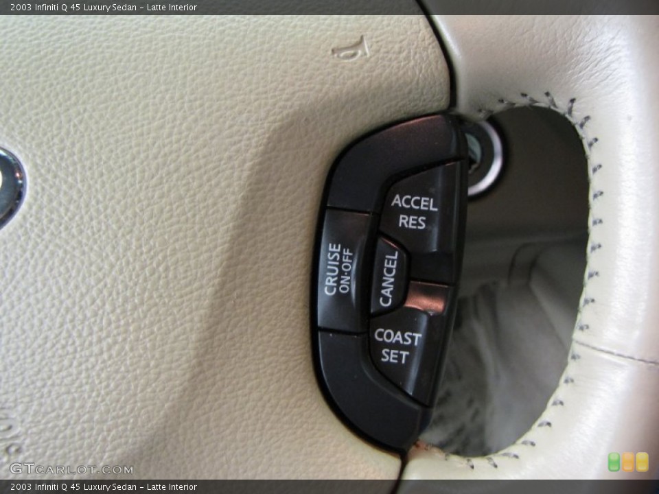 Latte Interior Controls for the 2003 Infiniti Q 45 Luxury Sedan #62890123