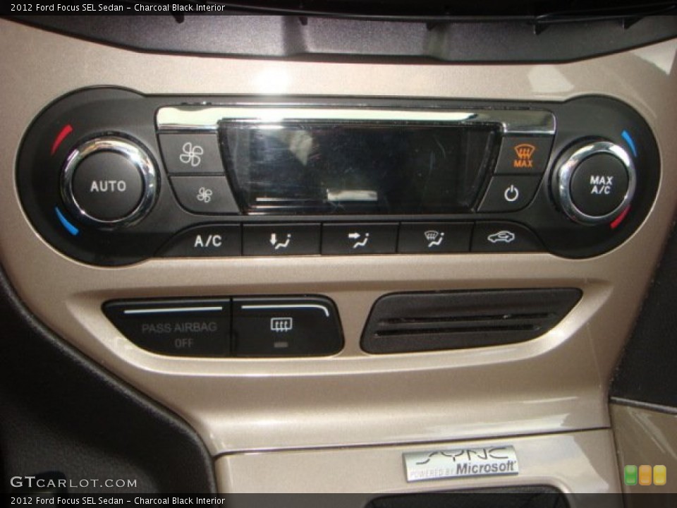 Charcoal Black Interior Controls for the 2012 Ford Focus SEL Sedan #63065428