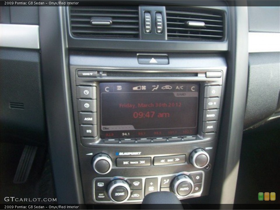 Onyx/Red Interior Controls for the 2009 Pontiac G8 Sedan #63261427