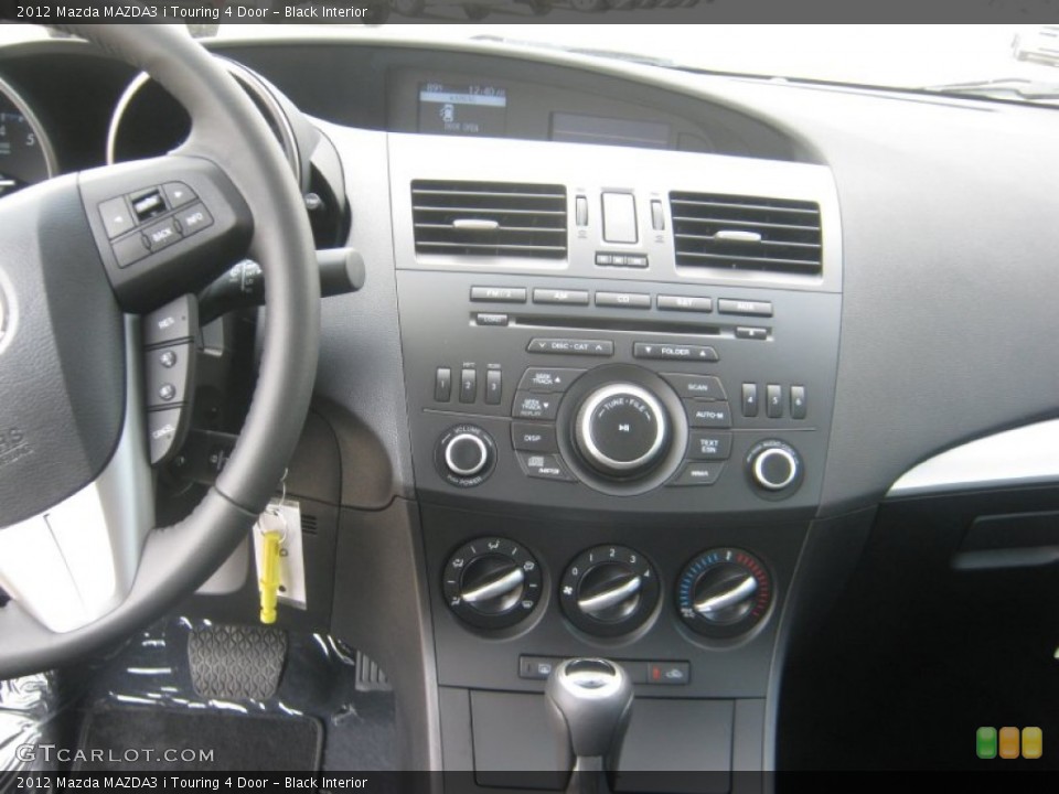 Black Interior Controls for the 2012 Mazda MAZDA3 i Touring 4 Door #63614692
