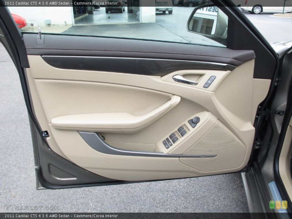 Cashmere/Cocoa Interior Door Panel for the 2011 Cadillac CTS 4 3.6 AWD Sedan #64382838