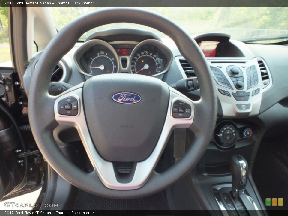 Charcoal Black Interior Steering Wheel for the 2012 Ford Fiesta SE Sedan #64409562