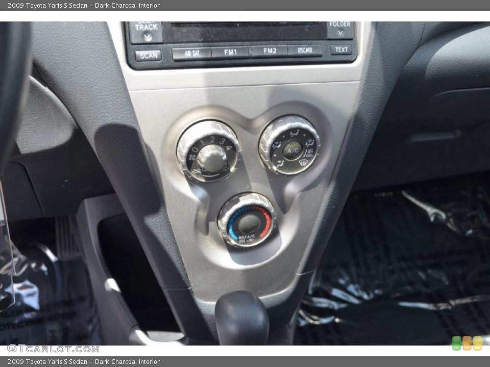 Dark Charcoal Interior Controls for the 2009 Toyota Yaris S Sedan #64890104