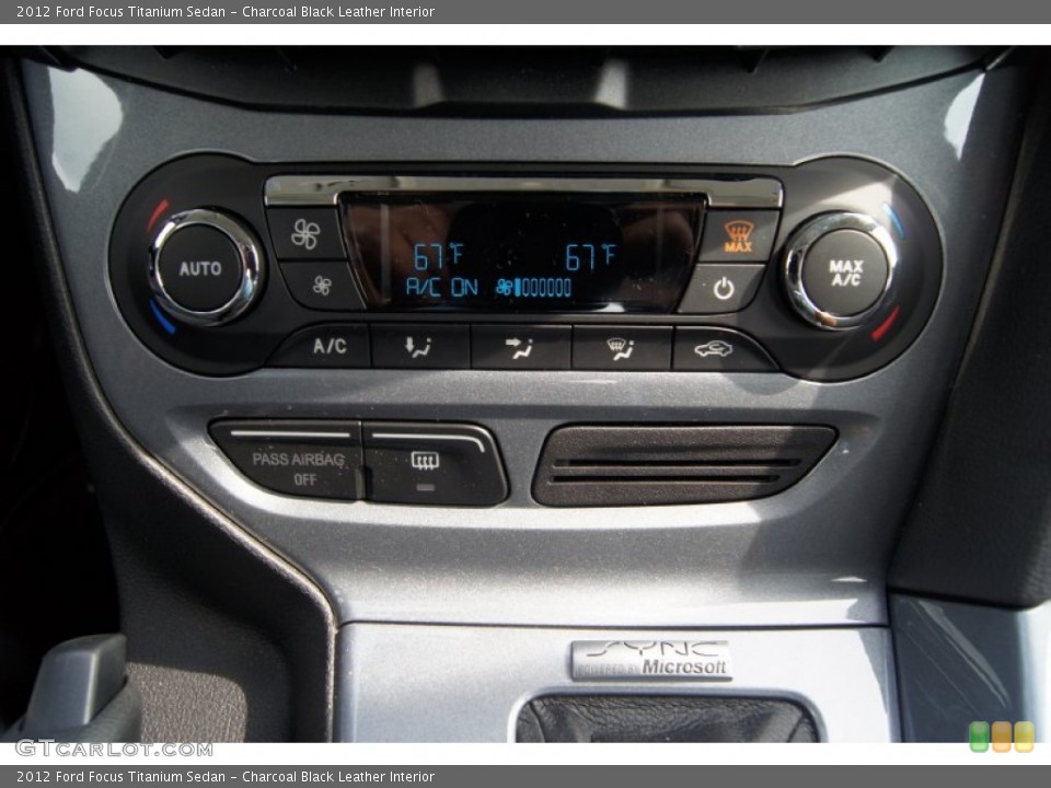 Charcoal Black Leather Interior Controls for the 2012 Ford Focus Titanium Sedan #65571599