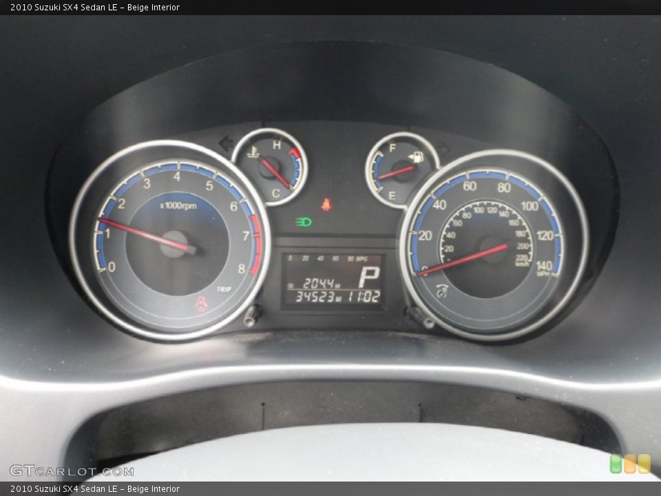 Beige Interior Gauges for the 2010 Suzuki SX4 Sedan LE #65605835