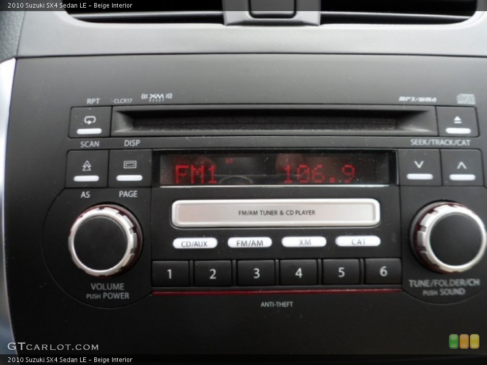 Beige Interior Audio System for the 2010 Suzuki SX4 Sedan LE #65605841