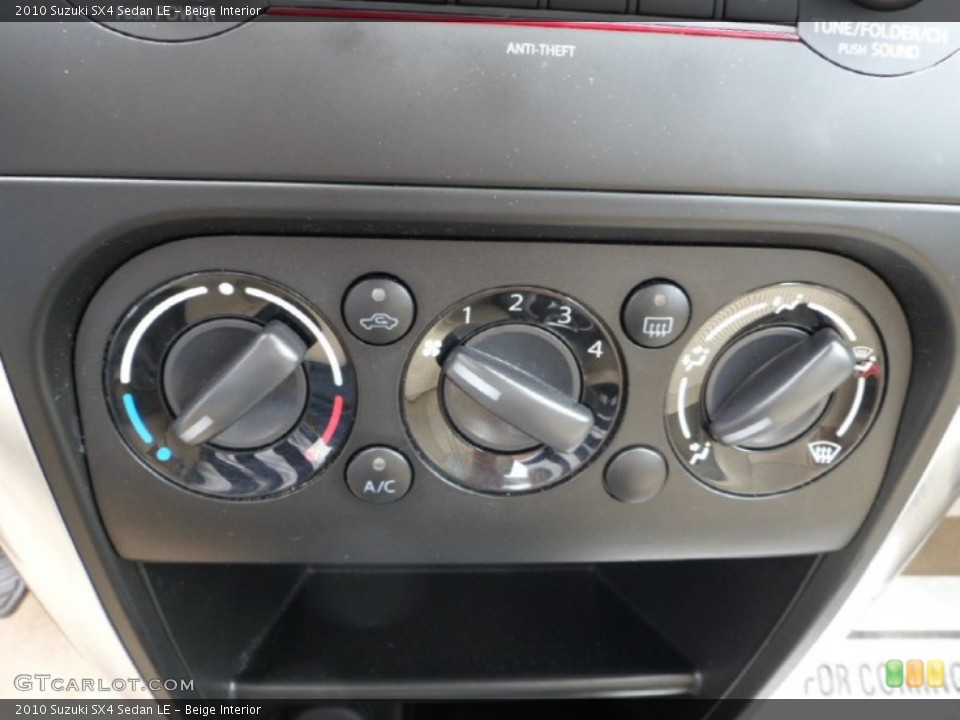 Beige Interior Controls for the 2010 Suzuki SX4 Sedan LE #65605844