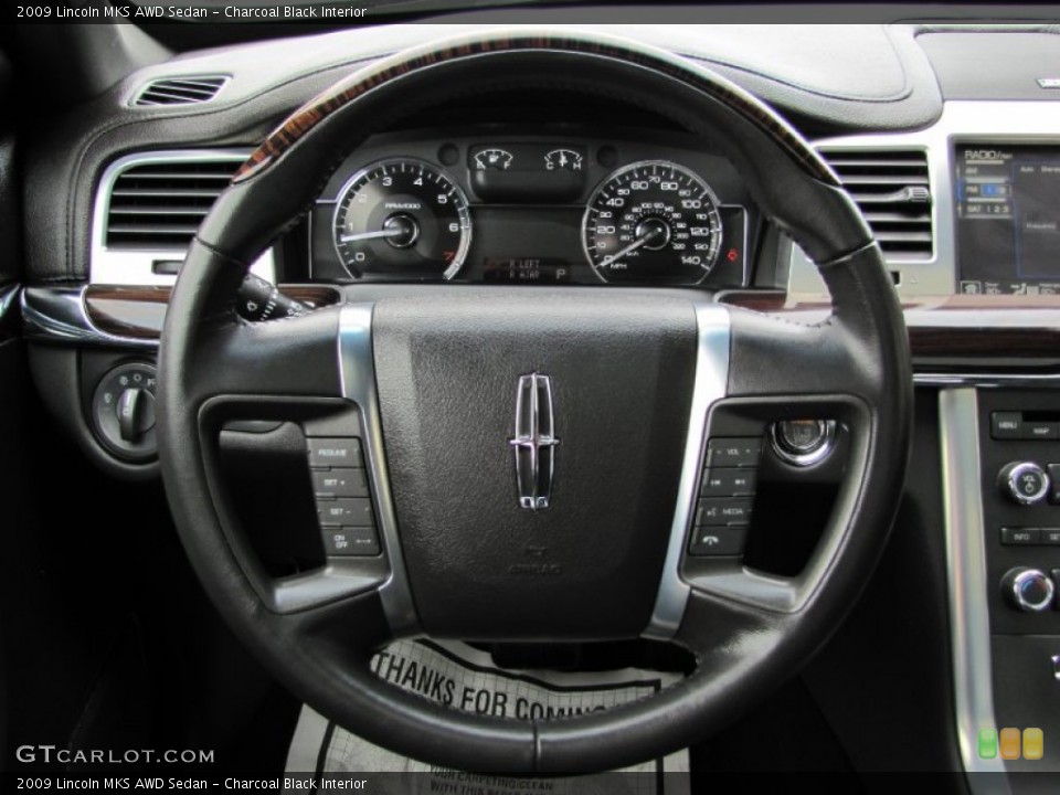 Charcoal Black Interior Steering Wheel for the 2009 Lincoln MKS AWD Sedan #65618963