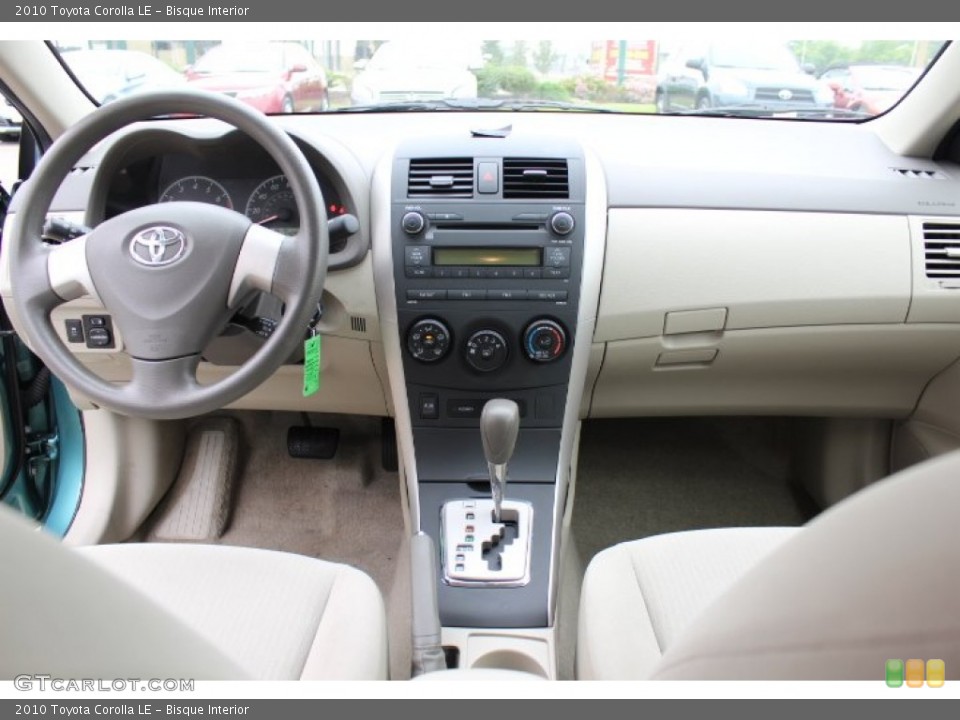 Bisque Interior Dashboard for the 2010 Toyota Corolla LE #65685615