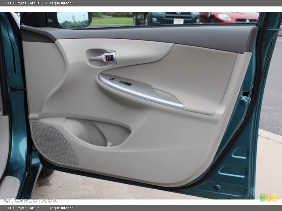 Bisque Interior Door Panel for the 2010 Toyota Corolla LE #65685669