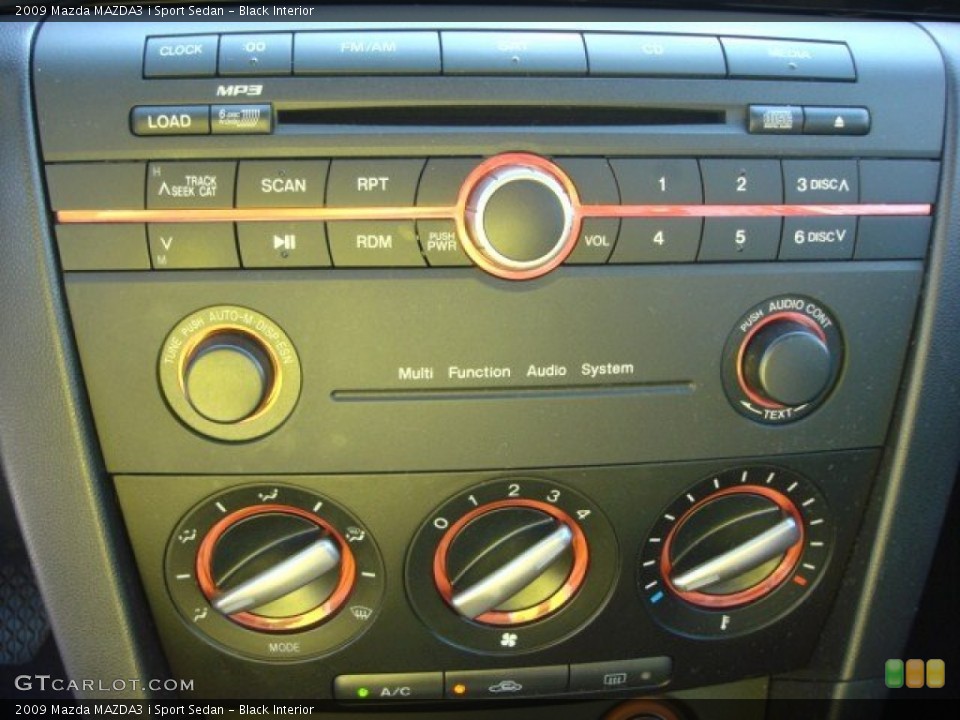Black Interior Controls for the 2009 Mazda MAZDA3 i Sport Sedan #65706806