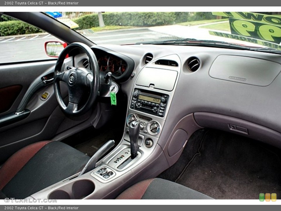 Black/Red Interior Dashboard for the 2002 Toyota Celica GT #66138599