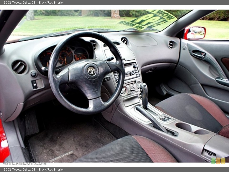 Black/Red Interior Prime Interior for the 2002 Toyota Celica GT #66138645