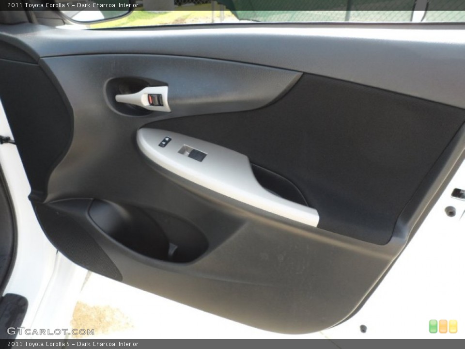 Dark Charcoal Interior Door Panel for the 2011 Toyota Corolla S #66167054