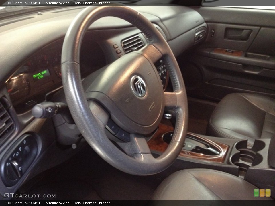 Dark Charcoal Interior Steering Wheel for the 2004 Mercury Sable LS Premium Sedan #66194437