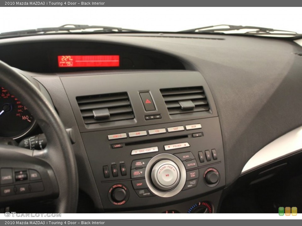 Black Interior Controls for the 2010 Mazda MAZDA3 i Touring 4 Door #66387176