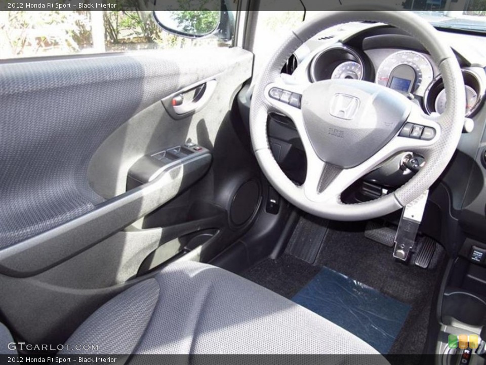 Black Interior Steering Wheel for the 2012 Honda Fit Sport #66432035