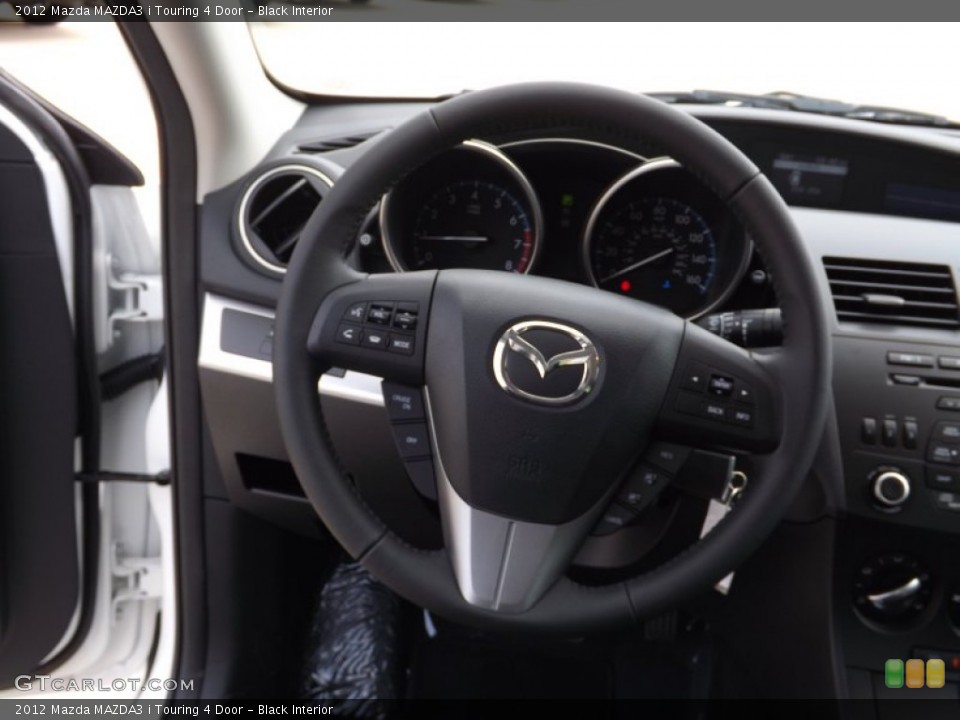 Black Interior Steering Wheel for the 2012 Mazda MAZDA3 i Touring 4 Door #66613733