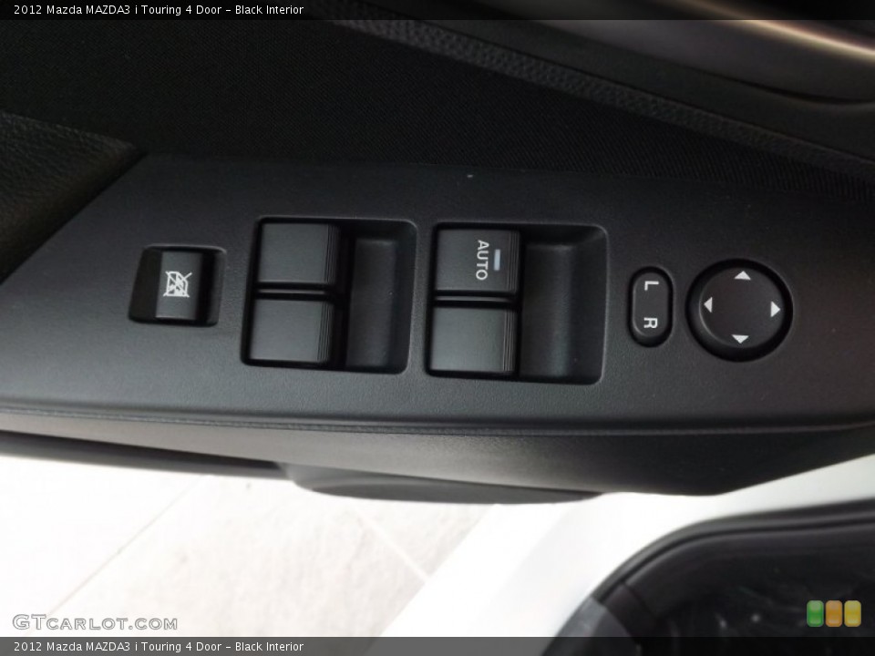 Black Interior Controls for the 2012 Mazda MAZDA3 i Touring 4 Door #66613787