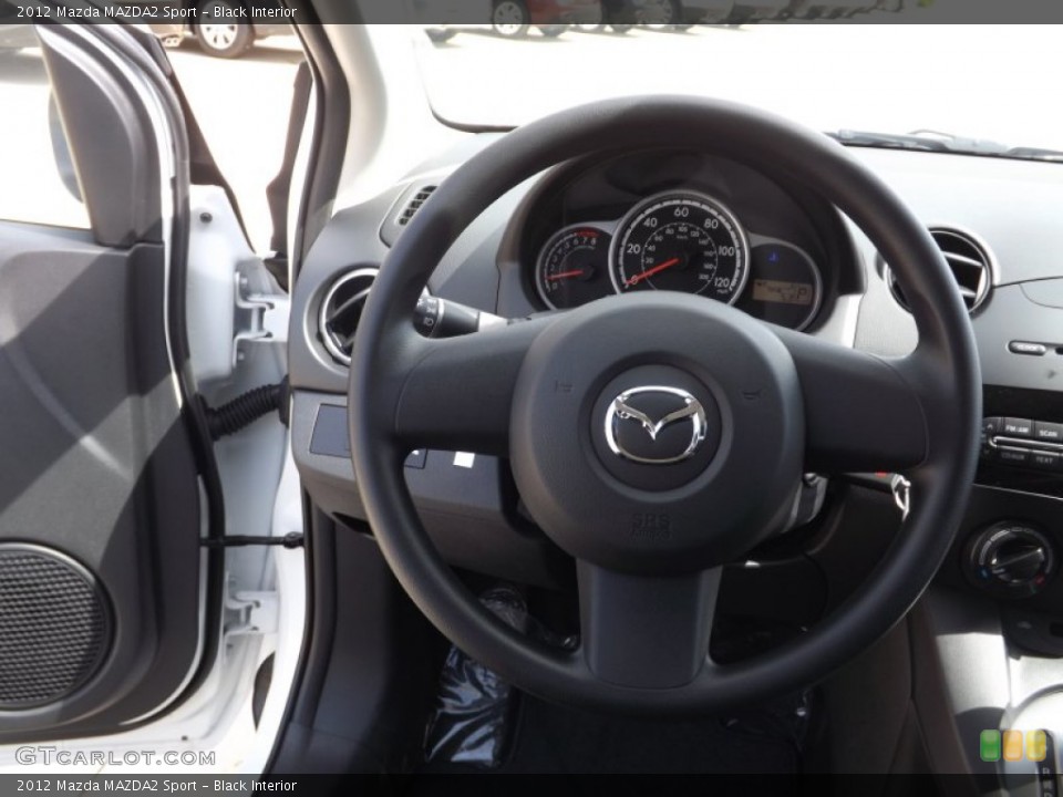 Black Interior Steering Wheel for the 2012 Mazda MAZDA2 Sport #66613835