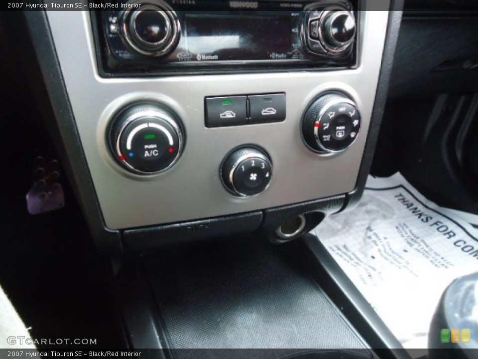 Black/Red Interior Controls for the 2007 Hyundai Tiburon SE #66654257