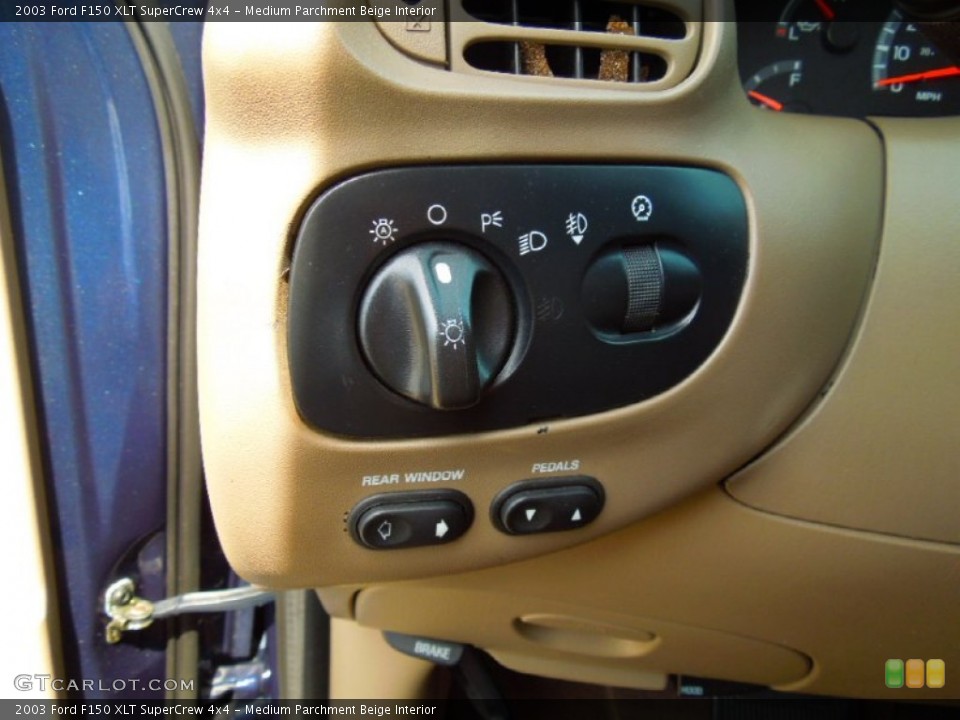 Medium Parchment Beige Interior Controls for the 2003 Ford F150 XLT SuperCrew 4x4 #66668552