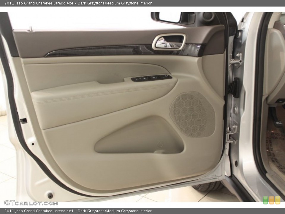 Dark Graystone/Medium Graystone Interior Door Panel for the 2011 Jeep Grand Cherokee Laredo 4x4 #66670685